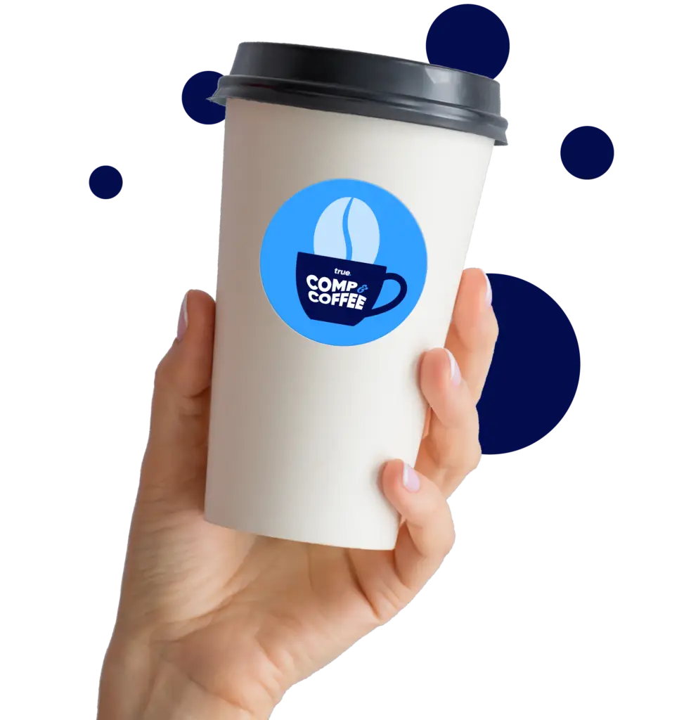 A hand holding a paper coffee cup with the Comp and Coffee logo